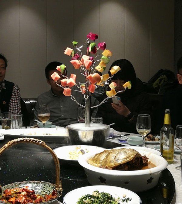 Small trees are offered pieces of fruit in China's restaurant. 